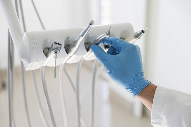 Professional Tooth Extraction technician working in Russell County County, KS